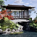 Traditional Chinese Landscape Pavilion With Stone Bridge Stream Lush Greenery Red Maple Leaves Water Lilies