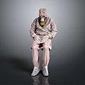The Man Sitting In Full Protective Suit With Yellow Gas Mask