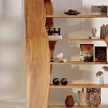 Wooden Display Cabinet With Open Shelves Holding Decorative Items Books And Ornaments