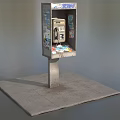 Public Telephone Booth With Advertisements And Metal Pole On Concrete Platform Outdoor