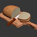 Fresh Loaf of Bread with Sliced Pieces on Wooden Cutting Board and Knife