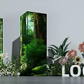 Floral Installation Featuring Three Forest Themed Display Pillars and Surrounding Flowers Green Plants