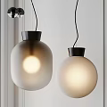 Two Modern Spherical Pendant Lights With Frosted Glass Shades And Black Bases