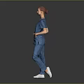 Woman In Blue Medical Scrubs With Lanyard ID Badge Standing Against Dark Background