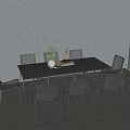 Stylish Black Outdoor Table With Woven Metal Chairs And Decorative Items