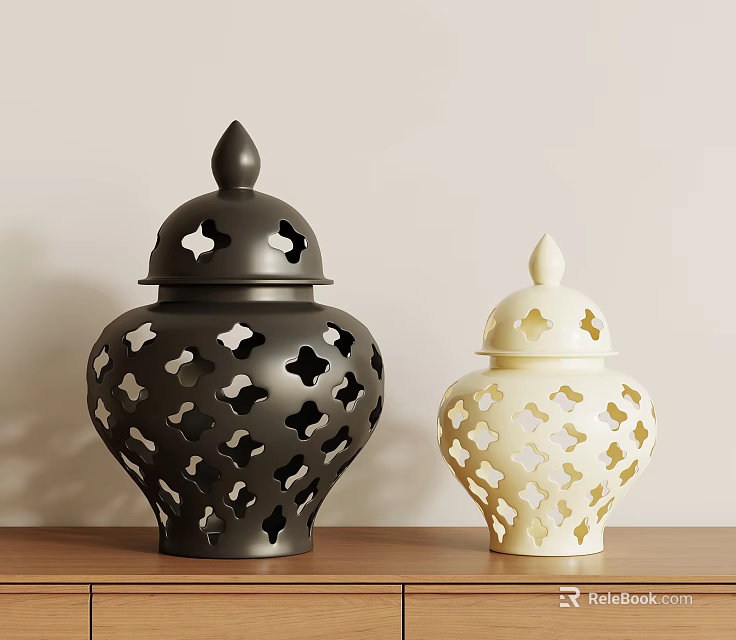 Decorative Black And Cream Vases With Cutout Patterns On Wooden Tabletop Against Light Wall 3d model 