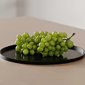 Fresh Green Grapes Placed on Black Plate Over Light Wooden Table