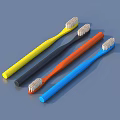 Four Colorful Toothbrushes Yellow Black Orange Blue For Daily Use Arranged In Row