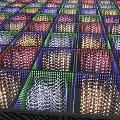 Colorful LED Light Square Panels On Floor Arranged In Grid With Illuminated Patterns