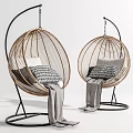 Stylish Rattan Hanging Chairs With Black Metal Frames Gray White Cushions And Cozy Blankets