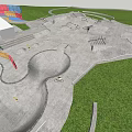 Outdoor Skate Park With Concrete Ramps Biking Area And Green Grass Surroundings