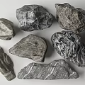 Natural Stone And Wood Pieces With Unique Textures And Shapes