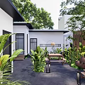 Outdoor Restaurant Patio With Wooden Tables Benches Greenery Trees Clay Pots White Building Lantern Lights