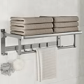 Bathroom Metal Towel Rack With Stacked Towels Hanging Towel And Bath Sponges