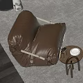 Brown Bean Bag Chair On Rug With Small Round Side Table And White Cup 3d model