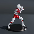Ultraman Action Figure In White And Red Suit With Battle Stance On Black Display Base