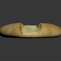 Freshly Baked Artisan Bread With Cross Shaped Creamy Topping And Golden Crust