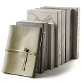Elegant Hardcover Books And Magazines Collection With Golden Gray Textured Covers And Ribbon Ties
