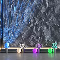 Gray Textured Background Wall With Blue Laser Beams And Colorful Glowing Spheres On Metal Base