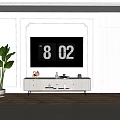 Modern White TV Stand With TV Decorative Items And Green Plant In Living Room
