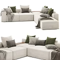 Upholstered Sectional Sofa With Green Gray Patterned Pillows And Throw Blanket 3d model