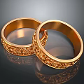 Ornate Gold Rings With Intricate Engraved Patterns And Shiny Finish
