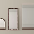 Three Different Wall Mounted Mirrors With Decorative Frames And Various Shapes