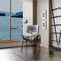 Cozy Indoor Scene With Gray Armchair Floor Lamp And Sea View Through Window