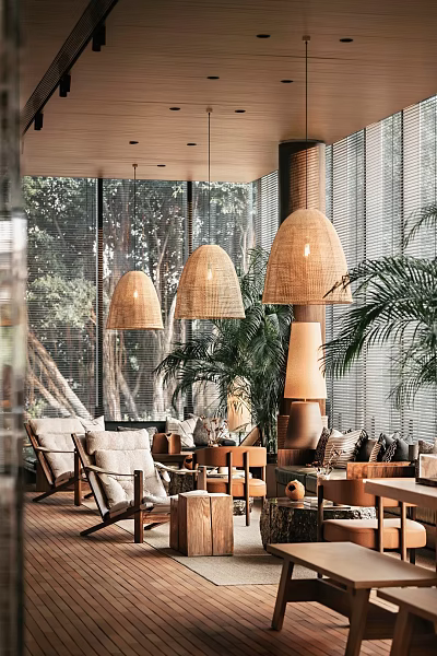 Cozy Casual Lounge Area With Wicker Pendant Lights Green Plants And Trees Outside Windows 3d model