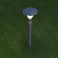 Modern Outdoor Light with Round Top and Cylindrical Pole Illuminating on Green Grass Lawn