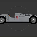 Audi Vintage Race Car With Silver Streamlined Body And Brown Leather Seat