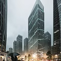Modern High Rise Office Building With Glass Curtain Wall Within Urban Skyline Featuring Lighting Effects