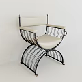 Modern Single Chair With Curved Black Metal Frame And Beige Leather Seat