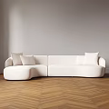 Plush White Abstract Shaped Sofa With Curved Design And Cushions In Herringbone Wooden Floor Interior