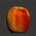 Bitten Ripe Apple Showing Juicy Flesh with Orange Red Skin on Dark Reflective Background