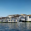 Modern Waterfront Guesthouse Buildings With Wooden Decks Overlooking Water And Green Lawn