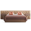 Tufted Beige Headboard Double Bed With Brown Blanket Orange Pillows And Nightstand