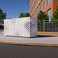 Industrial Equipment Featuring White Perforated Design Installed Outdoors Near Brick Building Trees And Metal Fence