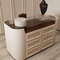 Modern Beige Jewelry Cabinet With Glass Top Drawers White Box And Black Sculpture