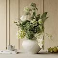 Elegant White Vase With Mixed Flowers Green Foliage And White Blooms On Wooden Table