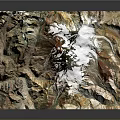 Detailed Artistic 3D Mountain Sculpture With Snowy Peak And Colorful Textured Design