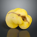 Single Yellow Blemished Fruit With Rotten Spots On Dark Reflective Surface