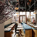 Modern Café Interior With Large Windows Hanging Lamps And Cozy Dining Seats