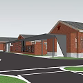 Red Brick Museum Building With Connected Structures Parking Lot And Green Courtyard