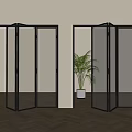 Partially Open Black Frame Folding Doors With Glass Mesh Panels And Potted Plant