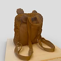 Brown Fluffy Backpack With Ear Shaped Decorations And Zipper Pocket On Wooden Board