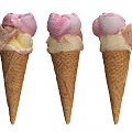 Three Tasty Waffle Cones Topped with Various Colorful Ice Cream Flavors