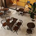 Modern Café Interior With Wooden Tables Chairs Green Plants And Hanging Pendant Lights