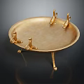 Golden Decorative Tray with Claw Shaped Supports and Ornate Legs for Home Decor