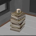 Candle Topped Stack of Books on Wooden Floor by Window with Black Blinds
